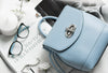 Light Blue Handbag With Glasses