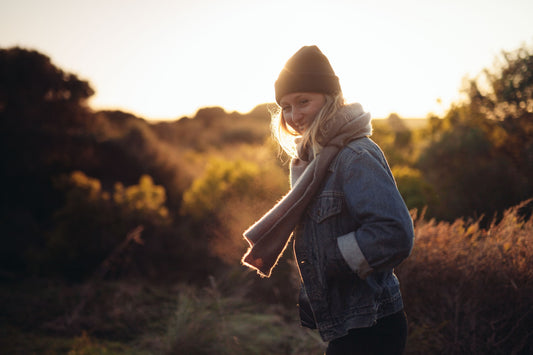 Smiling Woman With Seasonal Affective Disorder Outdoors To Beat Seasonal Blues
