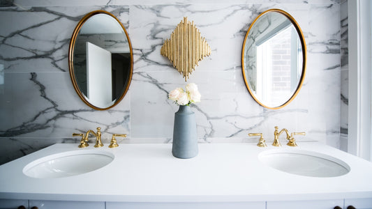 Two Bathroom Sinks With Gold Fixtures To Wash Your Hands Right And Stay Well