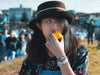 Woman Wearing Hat Eating Citrus Slice Managing Facial Pain
