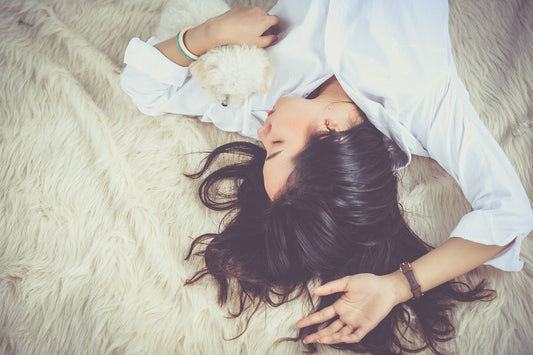 Woman Laying On Bed Getting Better Sleep