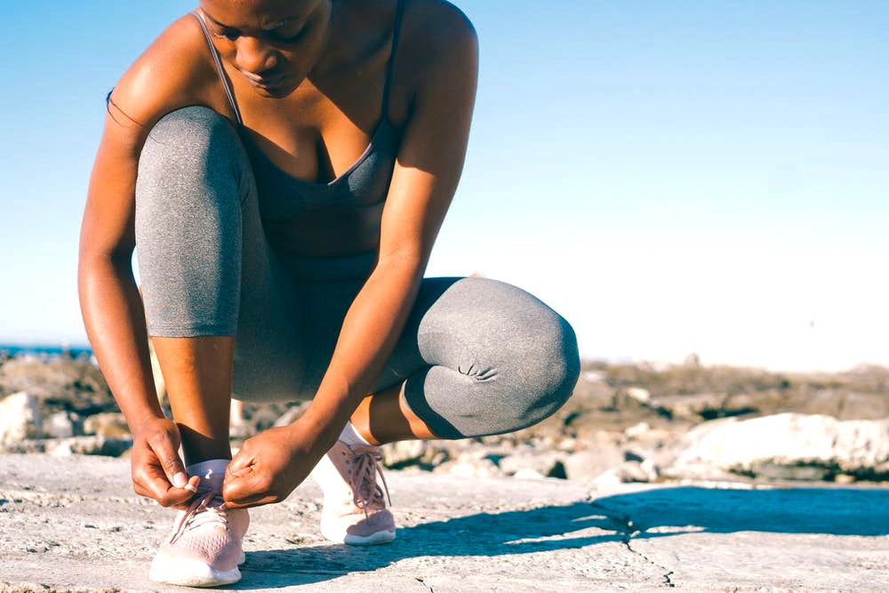 Woman Tying Sneakers For A Run