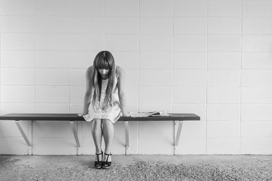 woman alone on a bench