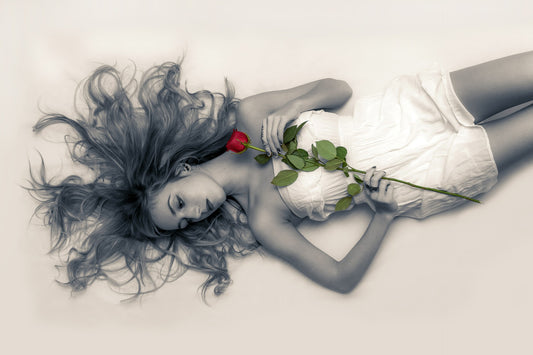 woman laying down with rose